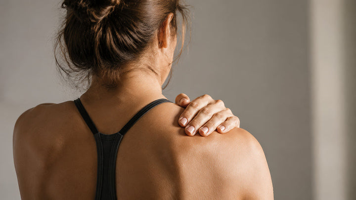 woman with shoulder muscle pain